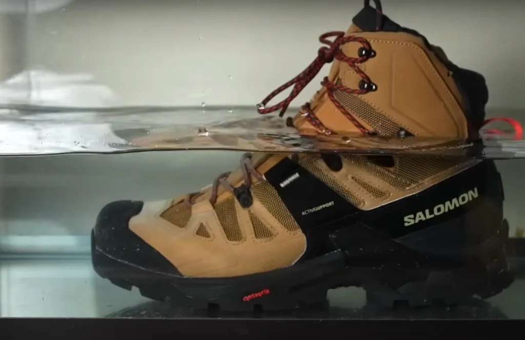 Gore-Tex waterproof test – hiking boot submerged in clear water basin for 8 minutes, boot stayed dry inside